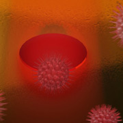 Примерно так выглядит вирус, попавший в оптическую ловушку, образованную дыркой в металлической плёнке (иллюстрация ICFO)
